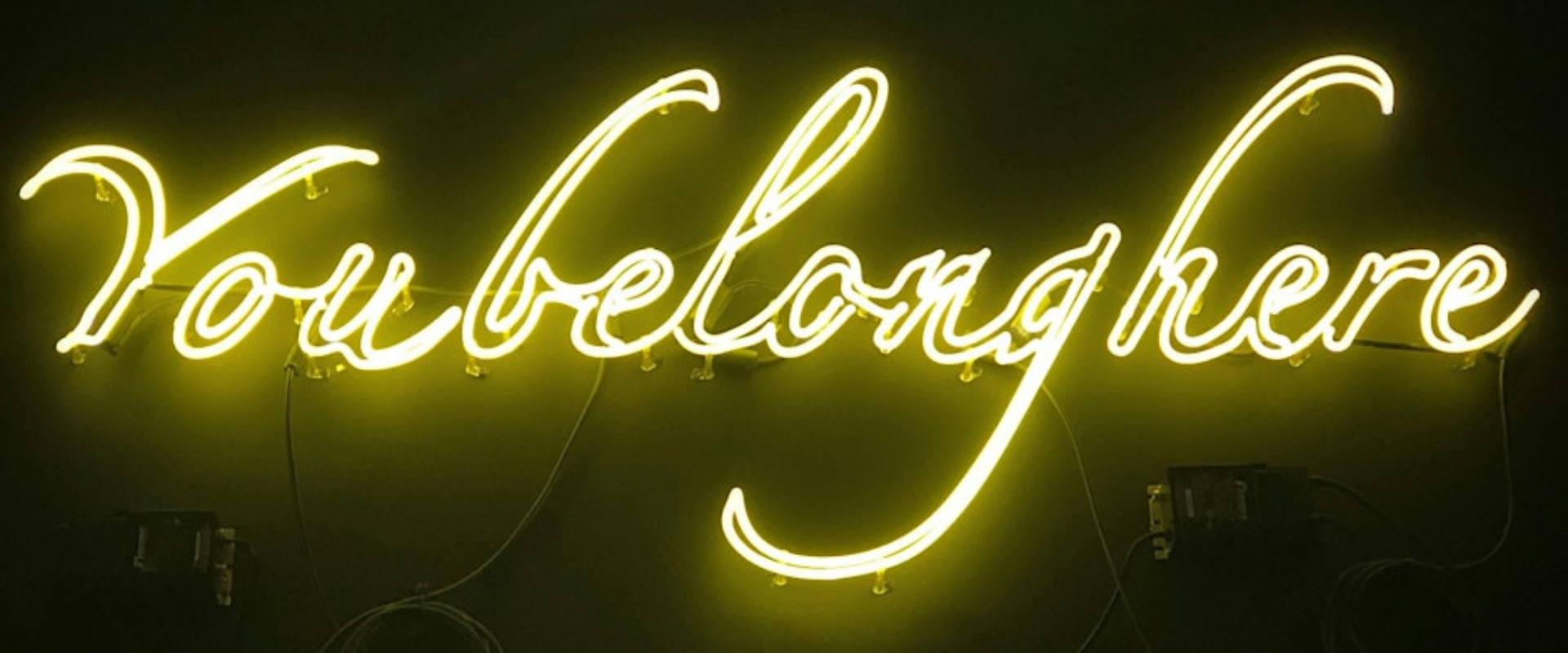 A neon sign saying 'You belong here'